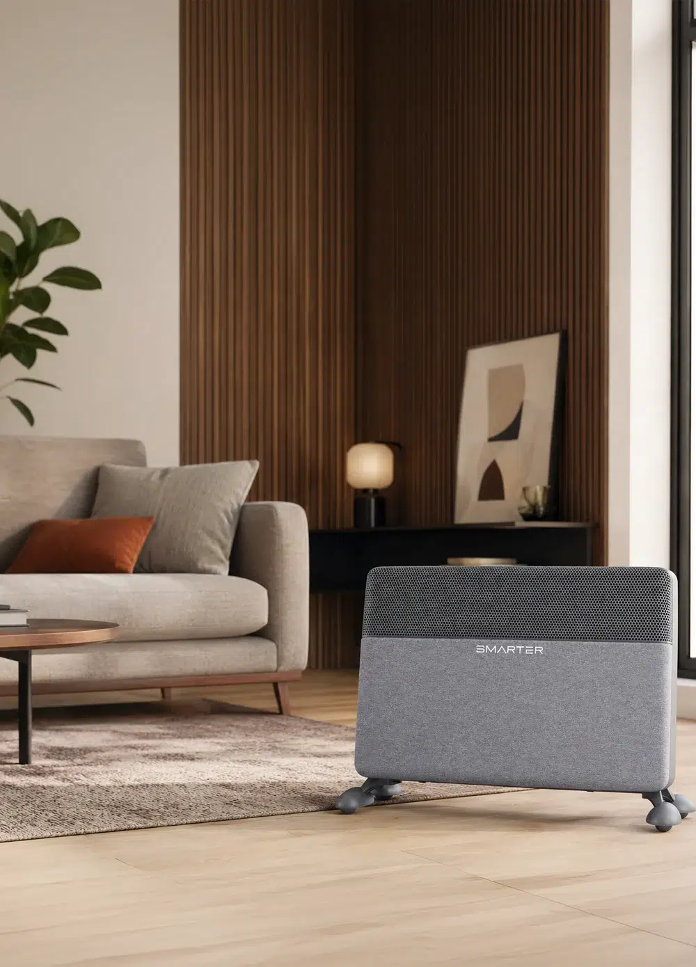 SMARTER FA1000 – תנור חימום אפור לצד ספה ושולחן בסלון